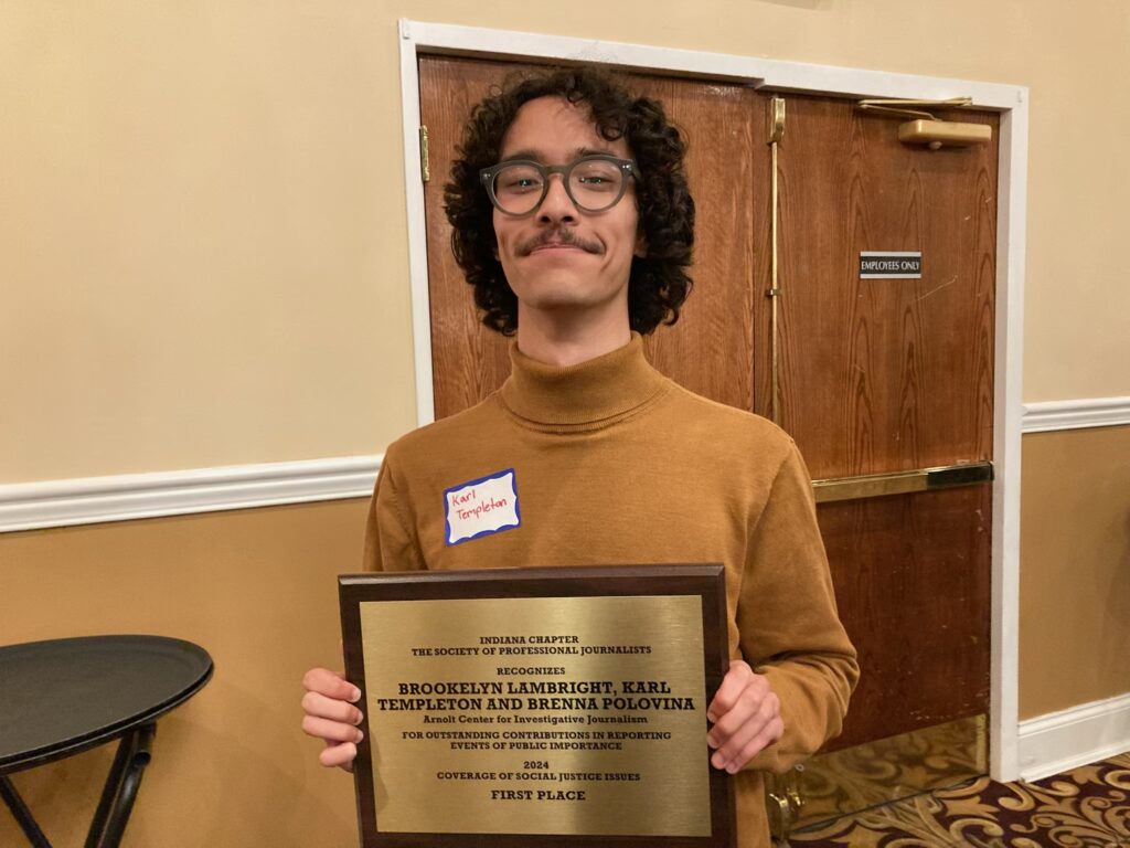 Center reporter Karl Templeton holds the first place award he won with Brookelyn Lambright and Brenna Polovina during the Indy SPJ award ceremony Friday, May 2, 2025. (Photo by Anne Kibbler)
